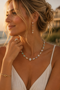 The Sea Glass Necklace on Waverly James model at golden hour by the coast