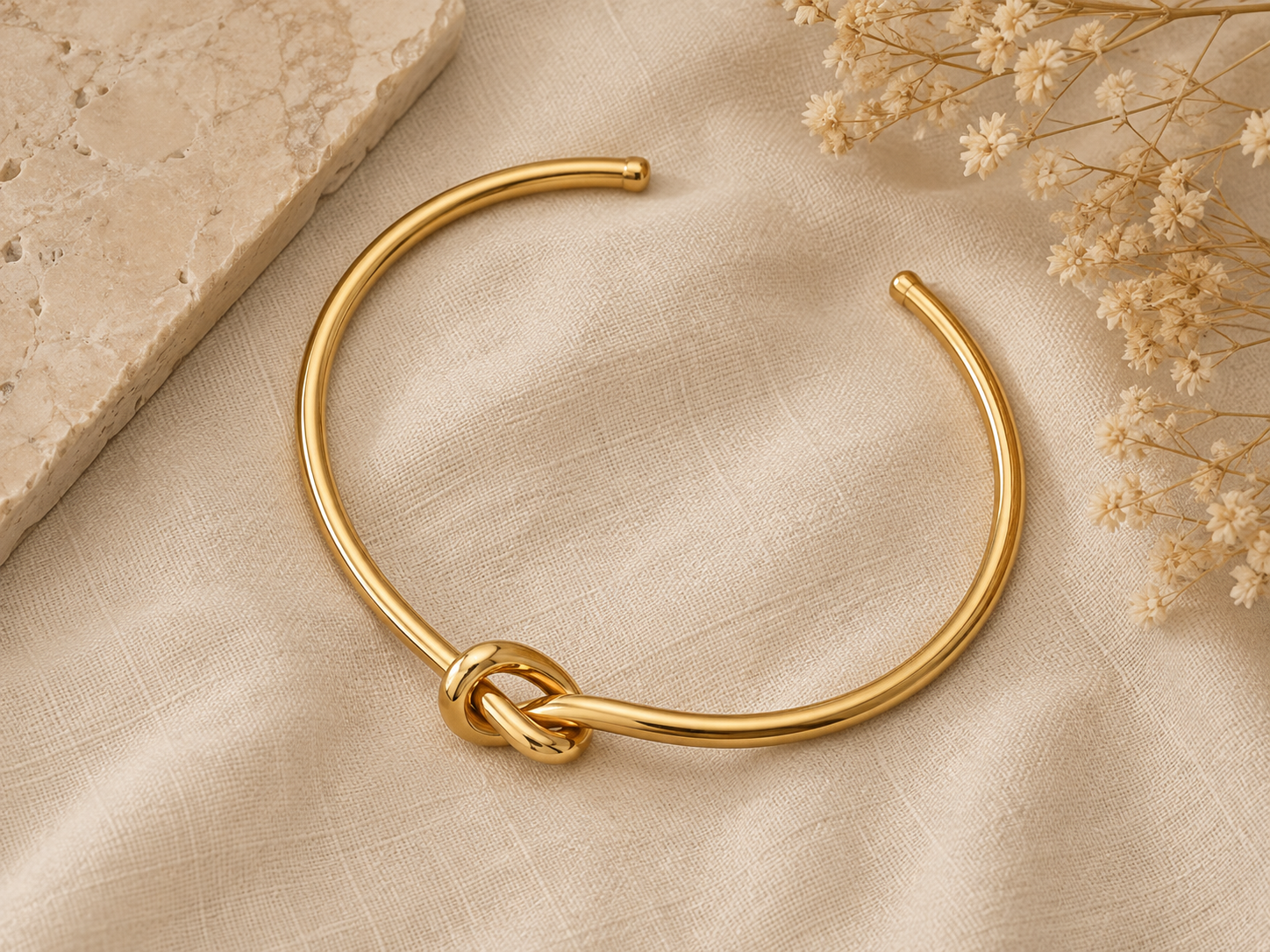 The Tybee Knot Cuff styled in a neutral coastal flat lay